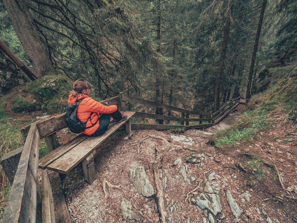 Tourist resting hiking path