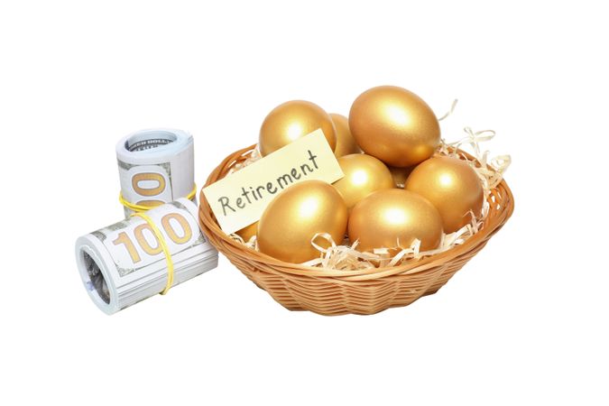 Concept of wealth and retirement - golden eggs, isolated on light background