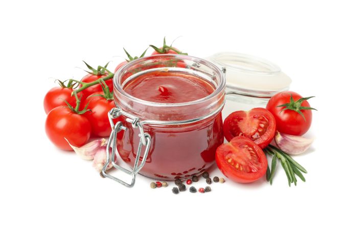 Tomatoes, sauce and ingredients isolated on neutral background