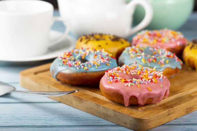 Delicious assorted colorful donuts on the table.