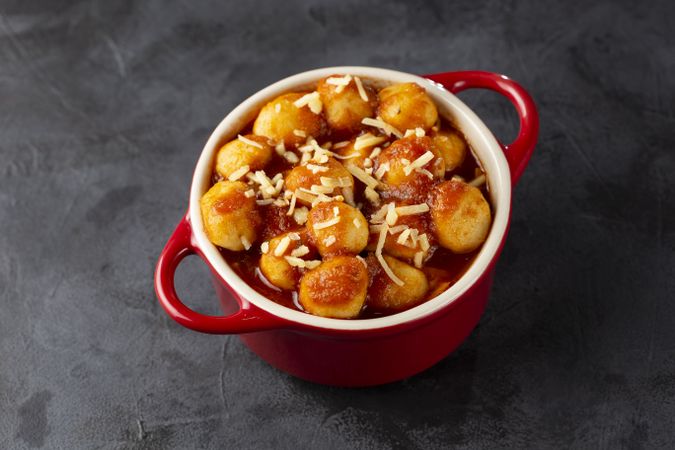 Gnocchi with tomato sauce and grated Parmesan cheese.