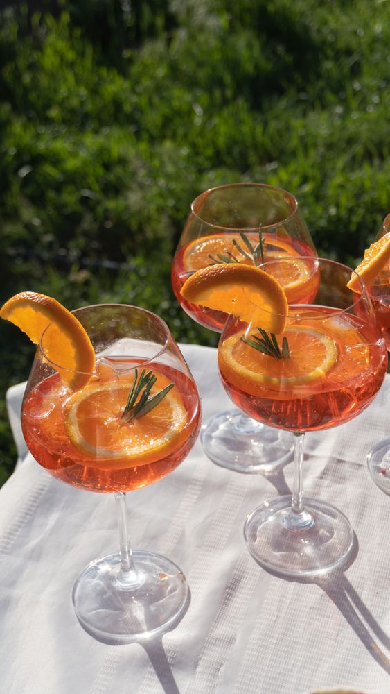 Spritz refreshing drink at the party on hot summer day serving