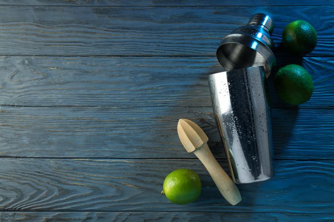 Concept of preparing cocktail, shaker, space for text