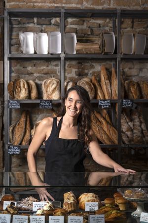 Young female selling baguettes
