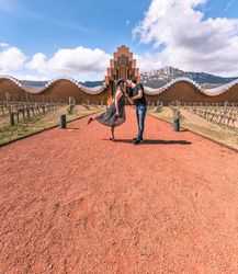Couple walking along breathtaking geometric architectural building