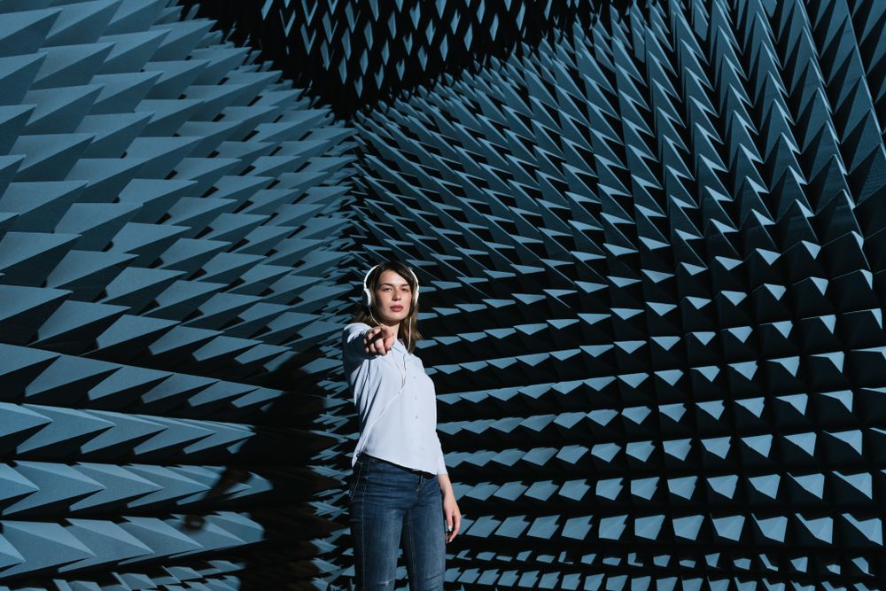 Woman in sound room listening to music