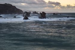 Storm with blustering waves on rocky coast