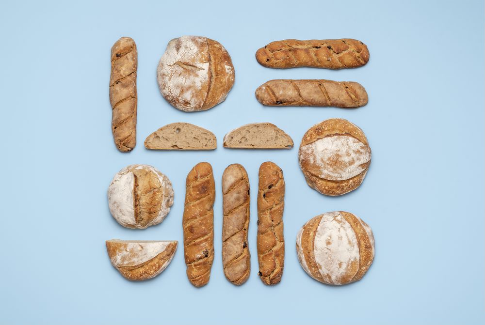 Sourdough bread variety top view on a blue background
