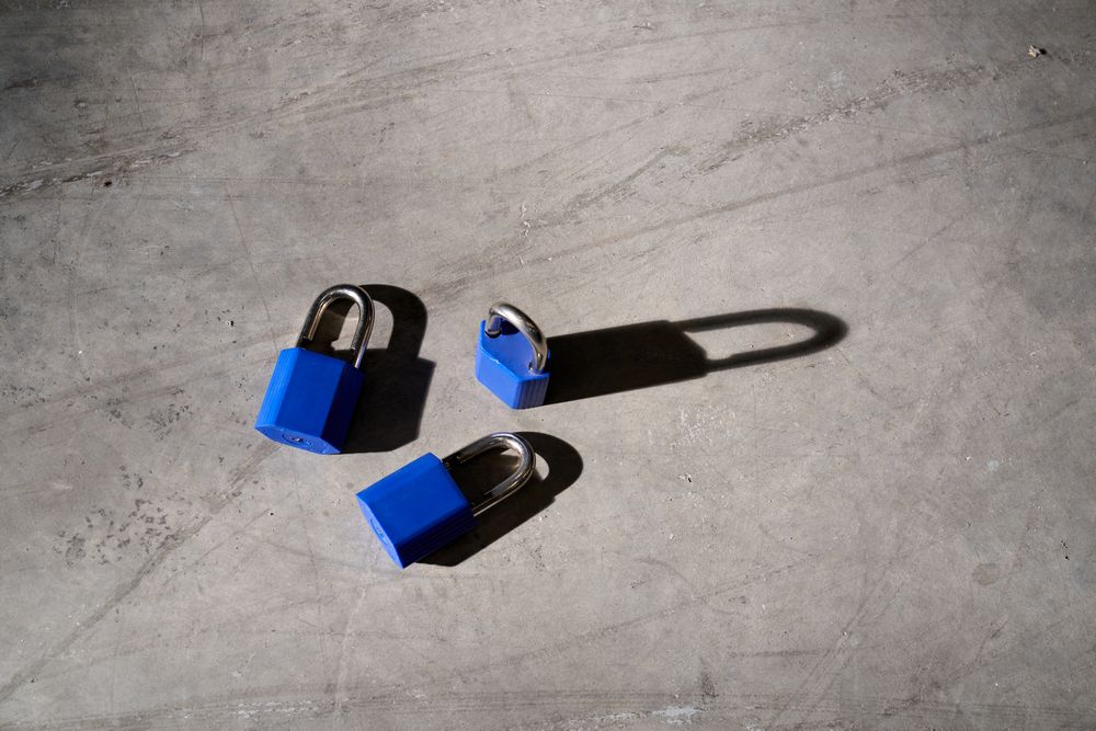 Set of blue lock on weathered gray surface