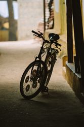 Bicycle parked on dark street