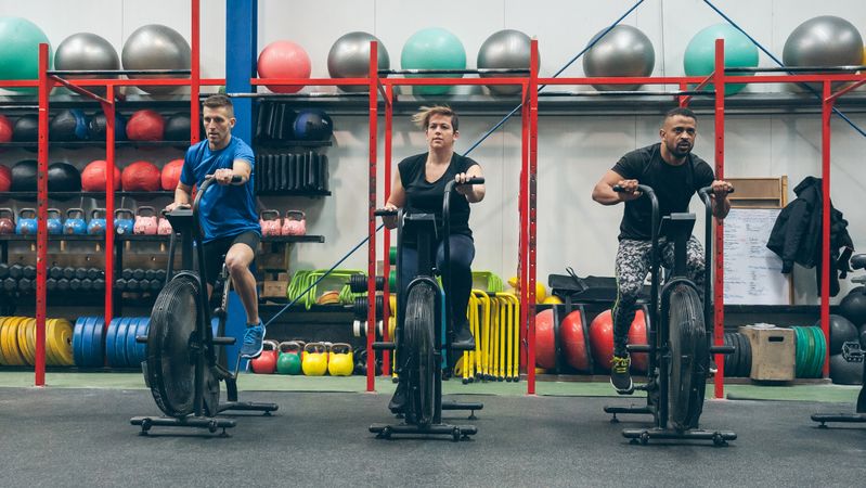 Athletes doing air bike indoor