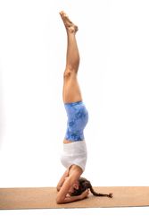 Advanced yoga inversion: headstand pose on eco-friendly mat