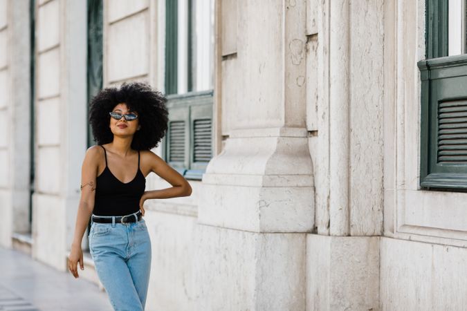 Cheerful Black female in dark sunglasses
