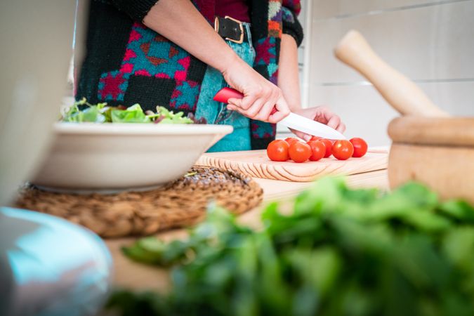 Woman preparing vegetable salad