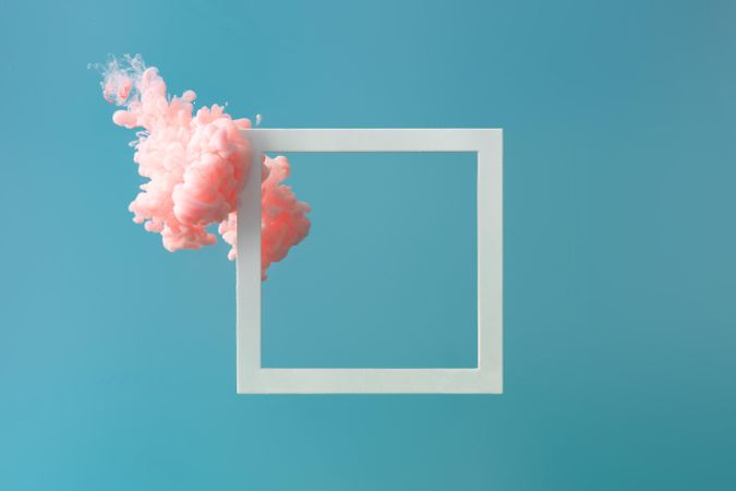 Cloud-like pink color paint with  light frame on blue background