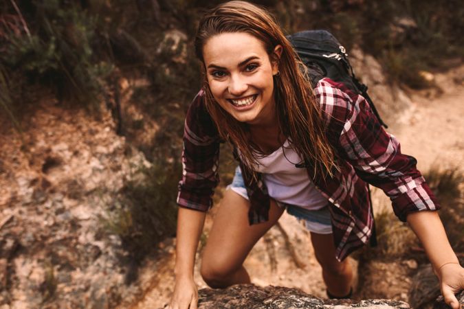 Female hiking over extreme terrain in mountain