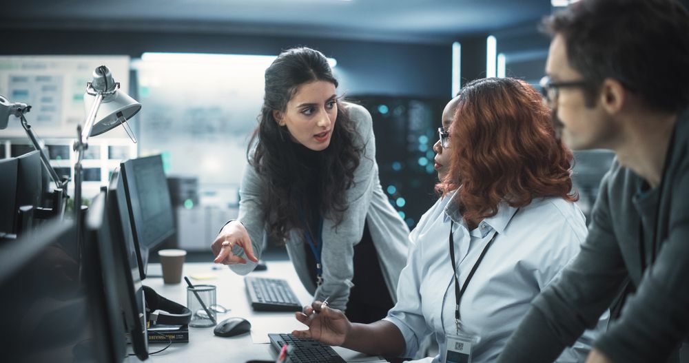 Empowered Black Female Specialists and Two Colleagues Work on Digital E-Commerce Startup Business