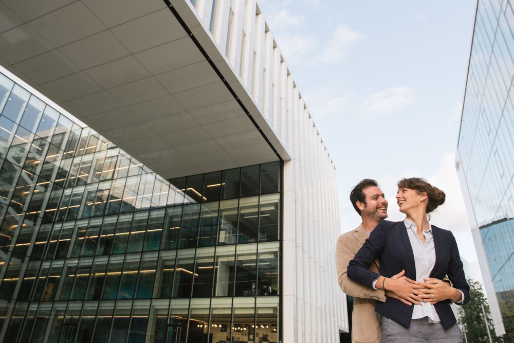 Businesspeople couple outside contemporary building