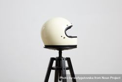 Side shot of motorcycle helmet on a stool 48L6K4