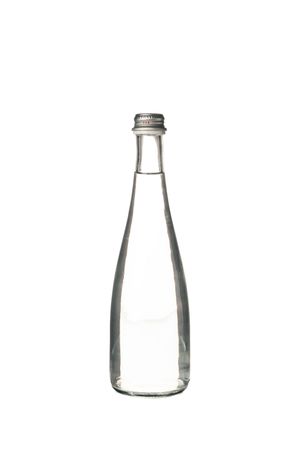 Glass water bottle in plain room
