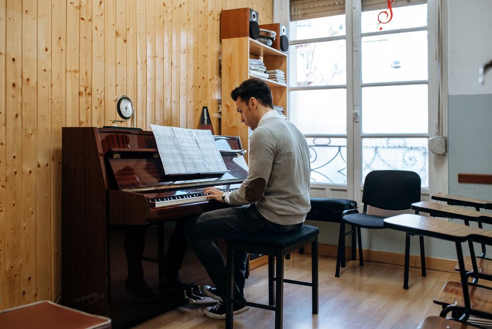 Man playing piano in studio