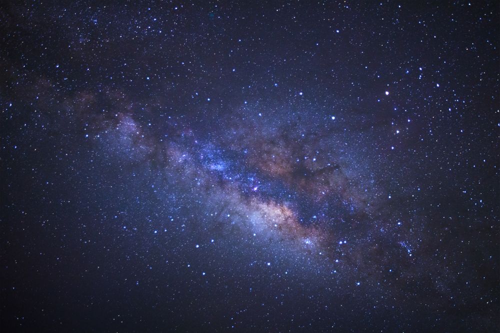 Milky way galaxy with stars and space dust in the universe, Long exposure photograph, with grain.
