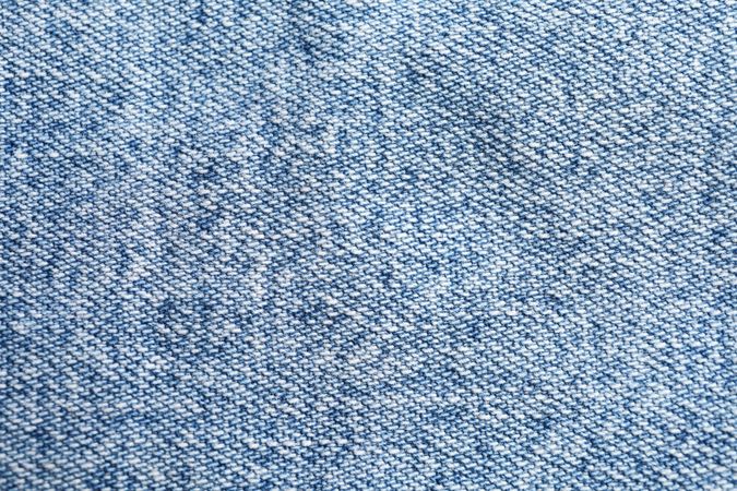 Texture of blue jeans as background, space for text