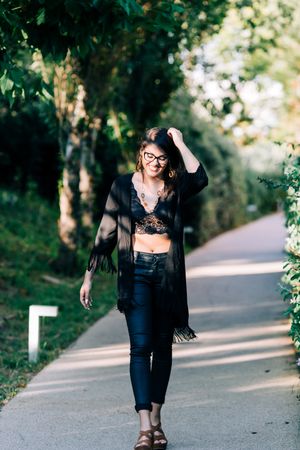 Cheerful female walking in park