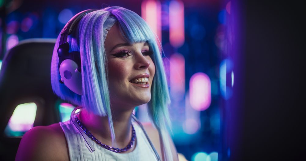 Happy Cosplayer Chats Online with Friends on Computer, Surrounded by Cyberpunk Style Background.