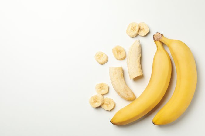 Bananas on blank background, top view. Fresh fruit