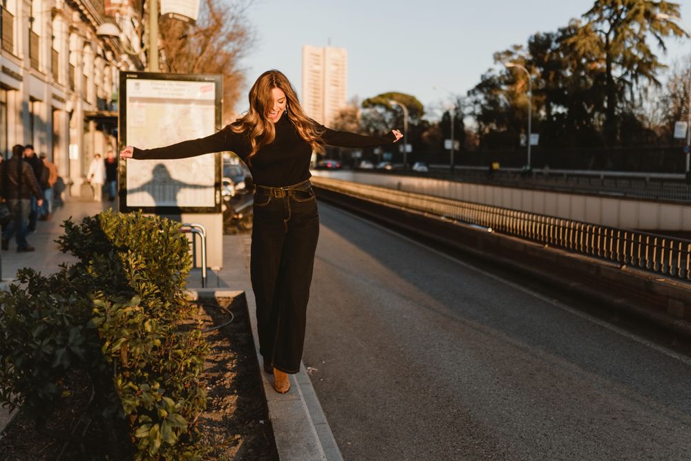 Stylish woman standing near metro station