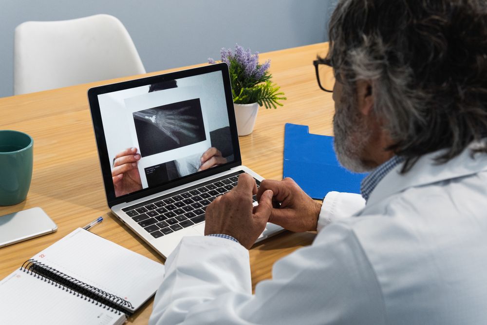 Doctor conducting telemedicine consultation with patient
