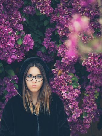 Woman on background of stunning violet flowers