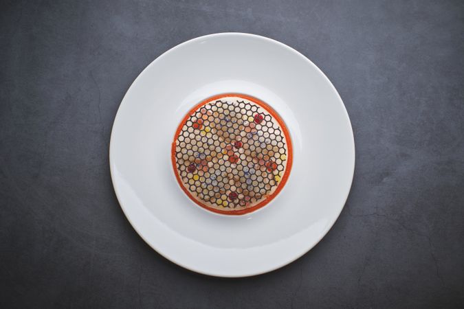 Delicious squid carpaccio with elegant squid ink grating