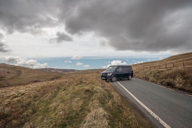 Car on road in hill terrain