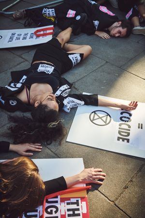 London, England, United Kingdom - September 15th,2019: Woman and man lying protesting on street