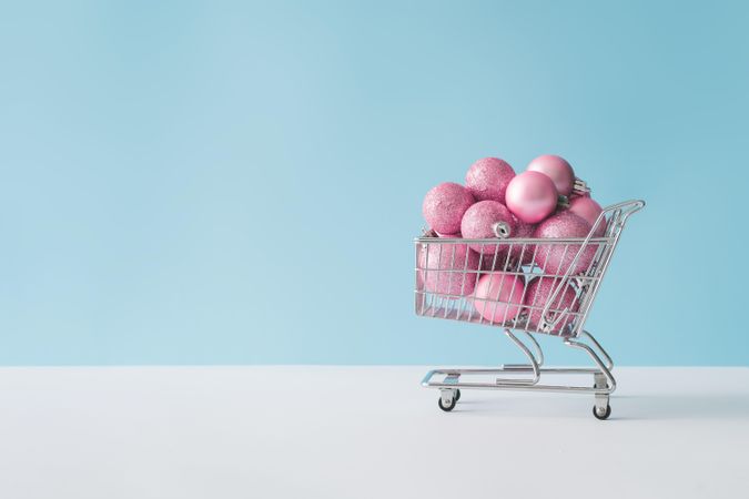 Shopping cart with pink Christmas decorations