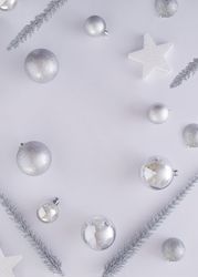 Top view of silvery Christmas decorations, copy space
