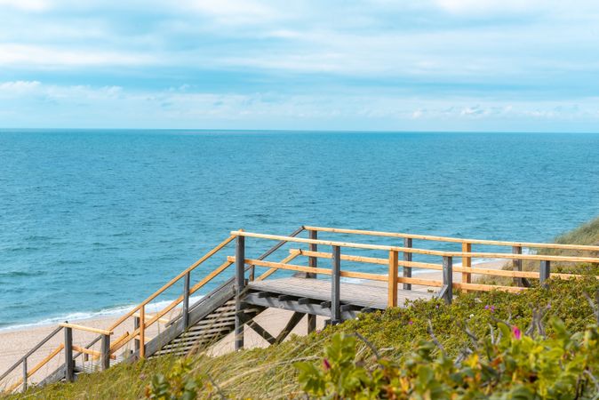 Wooden stairs on Sylt Island lead to the beach and to the North Sea