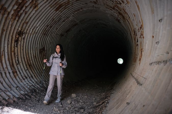 Hispanic woman standing in tunnel