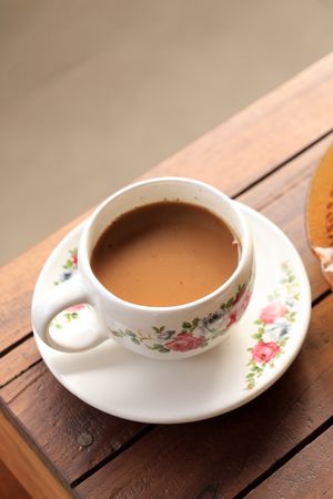 Morning Coffee with Flower Cup, Indonesian traditional Coffee with Gula Aren or Palm Sugar.