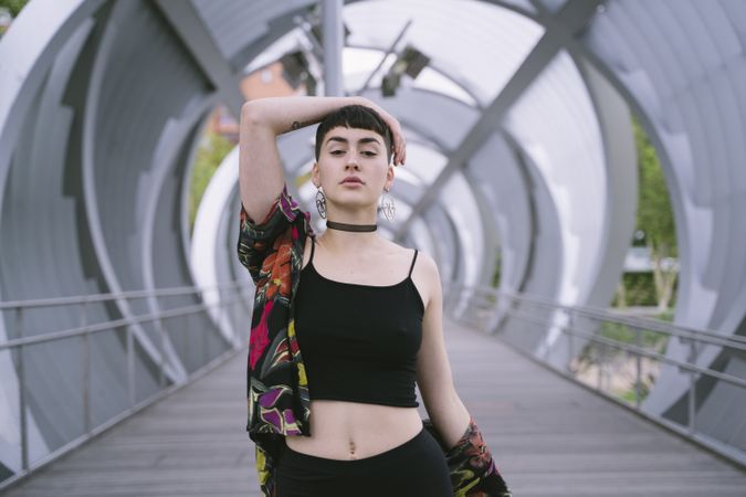 Woman in colorful shirt posing