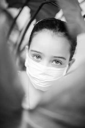 Grayscale portrait of girl with facemask