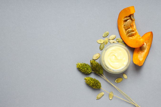 Skin care and face care concept - pumpkin cosmetic