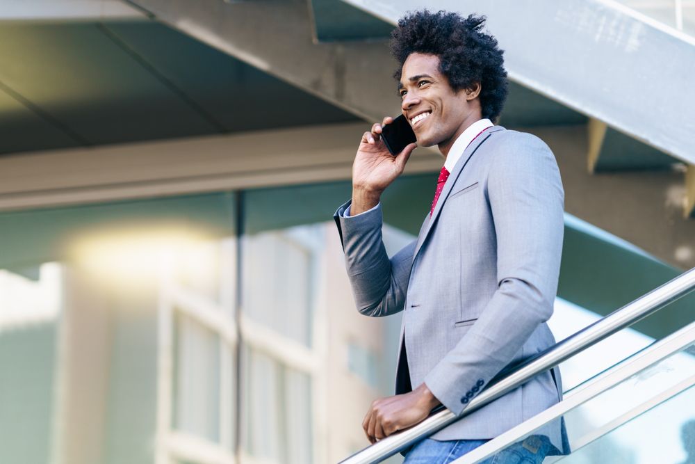 Man talking on his phone on staircase
