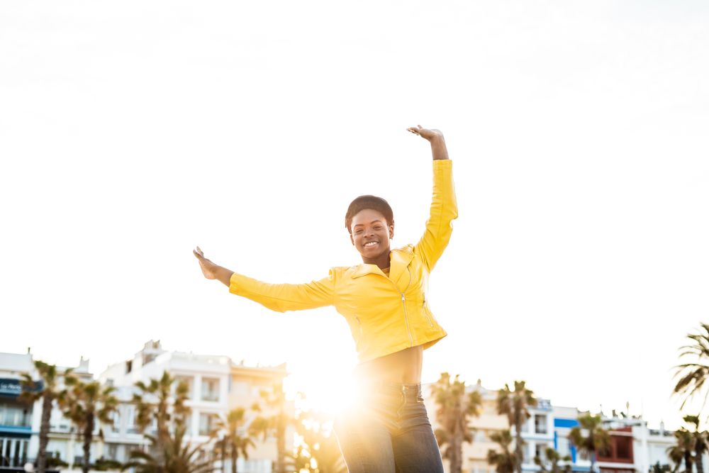 Joyful female smiling and jumping