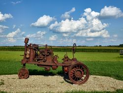 Rusted remains of a vintage tractor at the Hardin County Farm Museum, Eldora, Iowa