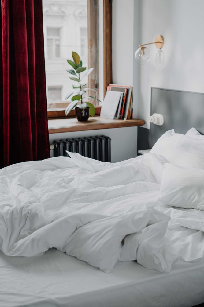 Interior view of bedroom with red curtain