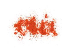Loose dark red spice sprinkled on blank background