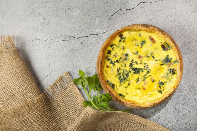 Spinach quiche with onion and bacon.